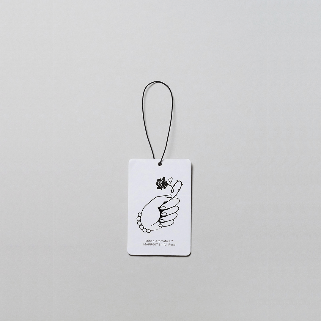 Sinful Rose Air Fragrance Card by Mihan Aromatics featuring a hand illustration on a white background.