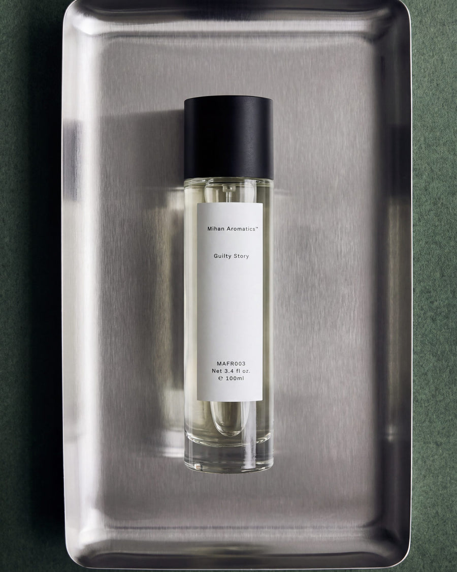 Mihan Aromatics Guilty Story parfum 100ml bottle on a steel tray