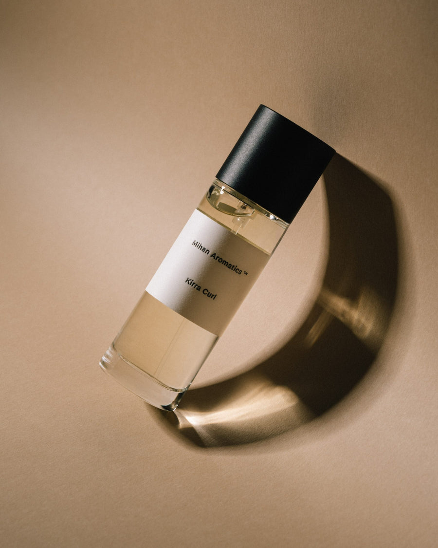 Mihan Aromatics Kirra Curl parfum 100ml bottle casting a shadow on sand