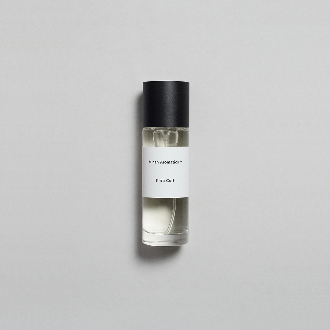 Kirra Curl Parfum by Mihan Aromatics in sleek glass bottle on a neutral background.
