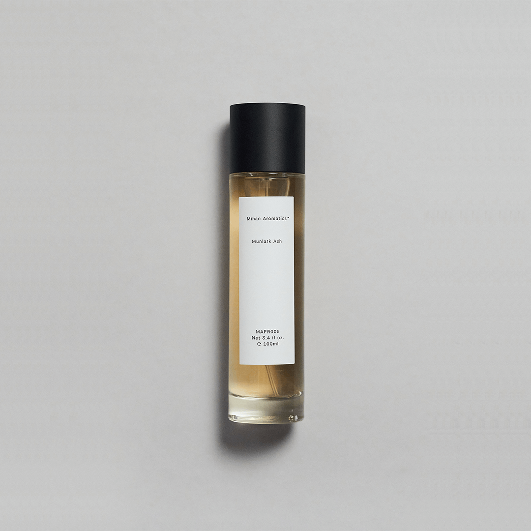 Munlark Ash Parfum by Mihan Aromatics, featuring a minimalist bottle with a simple label and a cool, earthy fragrance.
