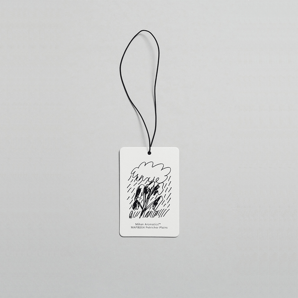 Mihan Aromatics Petrichor Plains Air Fragrance Card with artistic design for car and wardrobe scent enhancement.