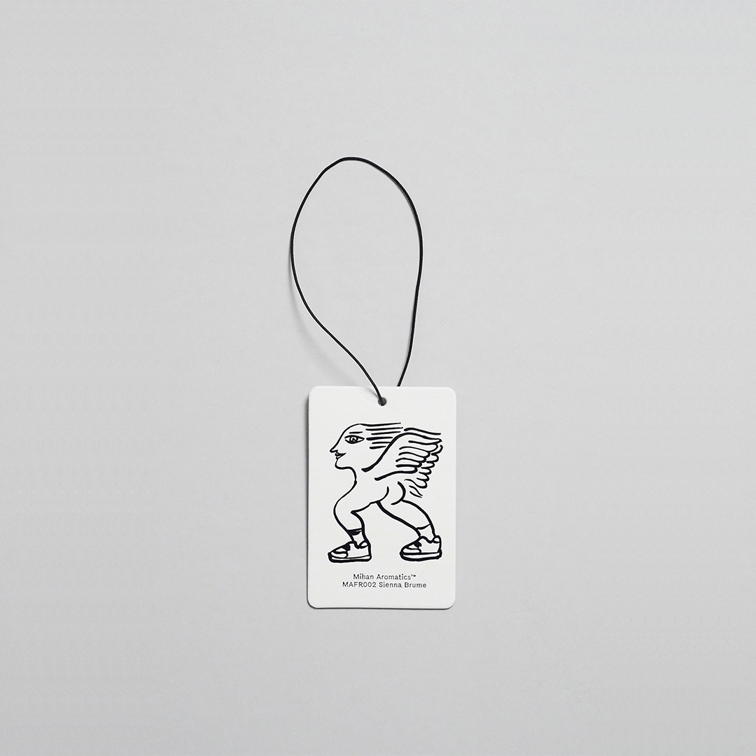 Sienna Brume Air Fragrance card by Mihan Aromatics featuring a unique design with a winged figure.