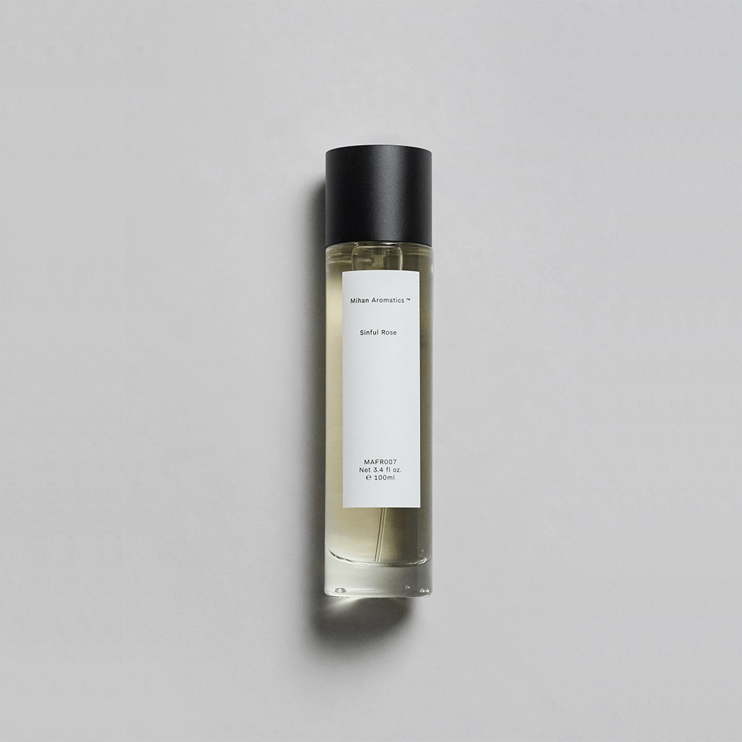 Sinful Rose Parfum by Mihan Aromatics in a sleek bottle, featuring a velvety rose and warm amber scent.