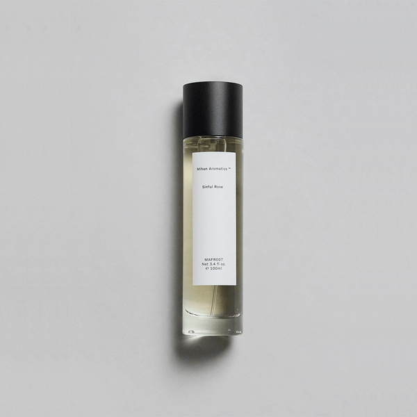 Sinful Rose Parfum by Mihan Aromatics in a sleek bottle, featuring a velvety rose and warm amber scent.