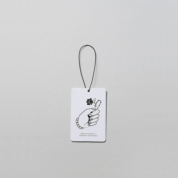 Sinful Rose Air Fragrance Card by Mihan Aromatics featuring a hand illustration on a white background.