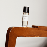 Kirra Curl Parfum by Mihan Aromatics on wooden surface, representing sun-kissed vibes and nostalgic scents.