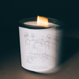 Lit Mihan Aromatics Guilty Story candle with soft motion blur in low light