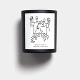 Mihan Aromatics Guilty Story candle in a black vessel with illustrated label on a Studio Grey backdrop