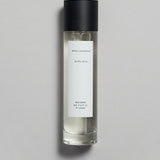 Mihan Aromatics Guilty Story parfum 100ml bottle with black cap on a pale grey backdrop