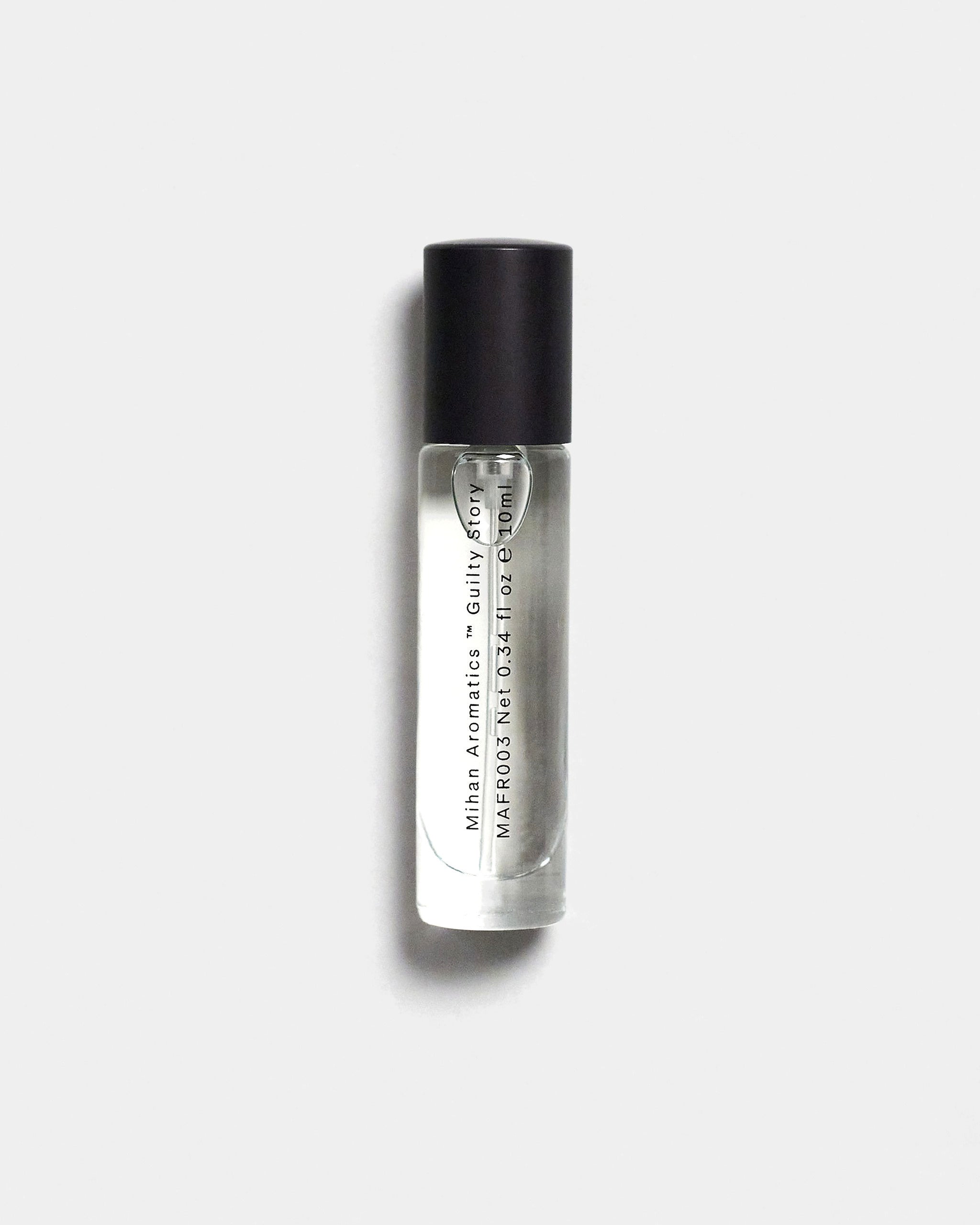 Mihan Aromatics Guilty Story parfum 10ml bottle with black cap on a Studio Grey backdrop
