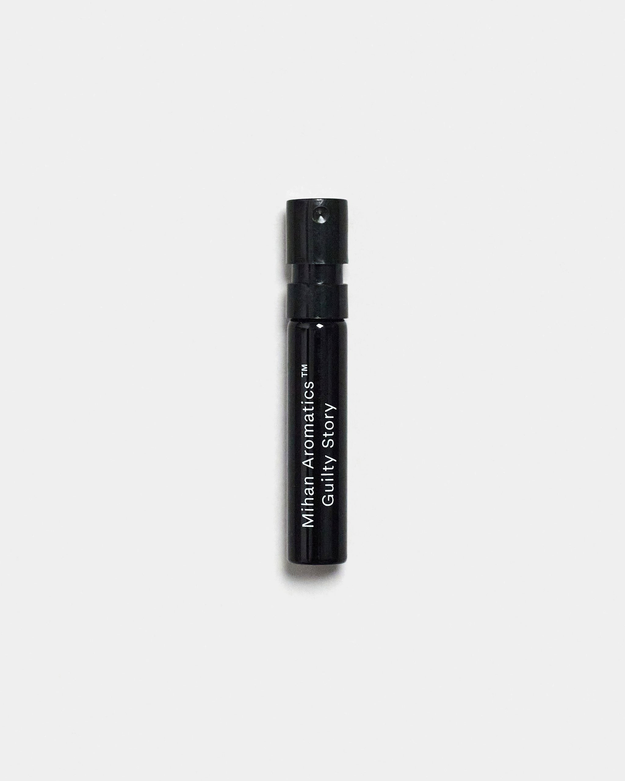 Mihan Aromatics Guilty Story parfum 2ml sample vial on a Studio Grey backdrop