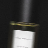 Close view of the Mihan Aromatics Guilty Story parfum bottle and label in low light