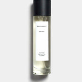 Mihan Aromatics Kirra Curl parfum 100ml bottle with black cap on a Studio Grey backdrop