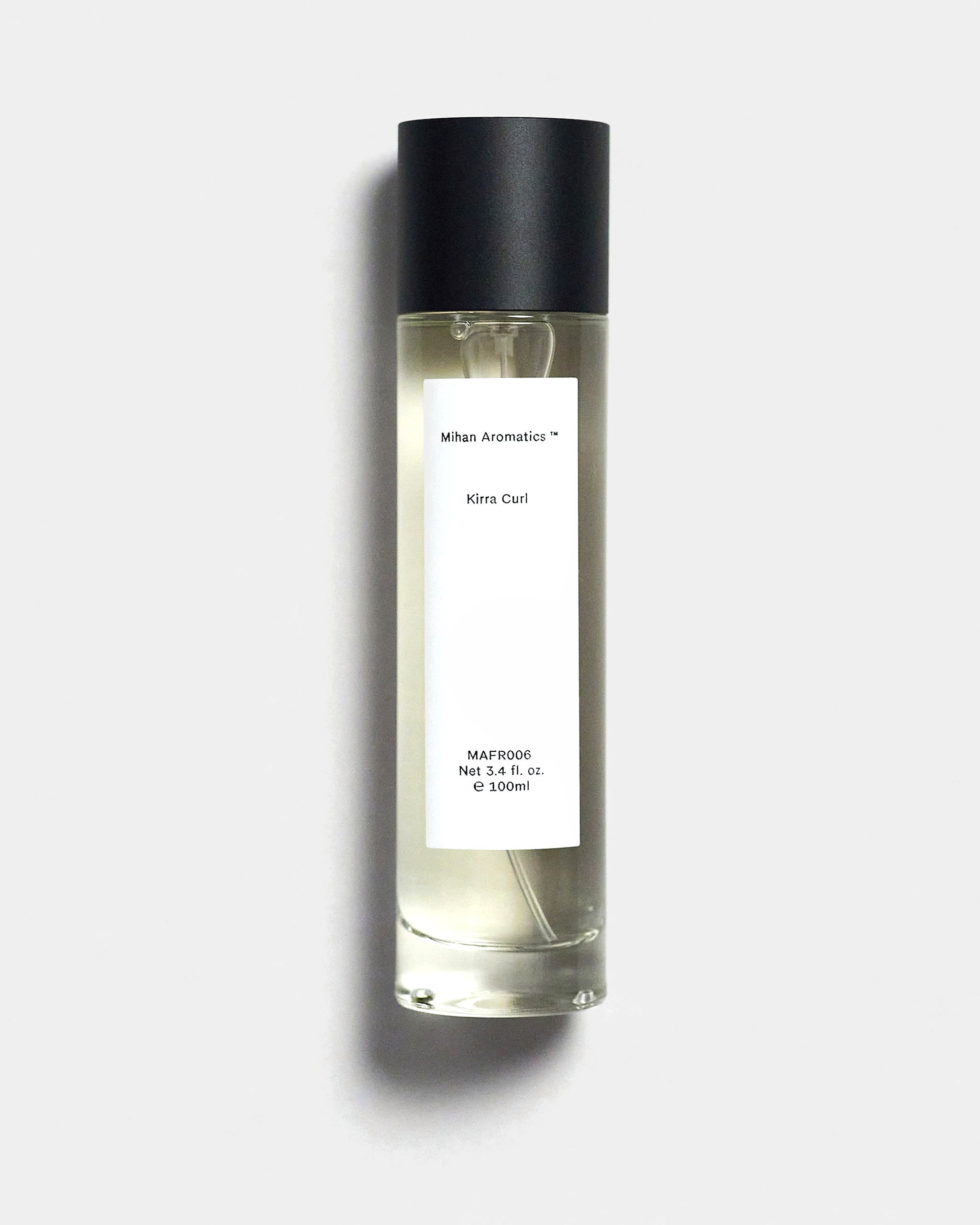 Mihan Aromatics Kirra Curl parfum 100ml bottle with black cap on a Studio Grey backdrop