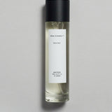 Mihan Aromatics Kirra Curl parfum 100ml bottle with black cap on a pale grey backdrop