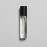 Mihan Aromatics Kirra Curl parfum 10ml bottle with black cap on a pale grey backdrop
