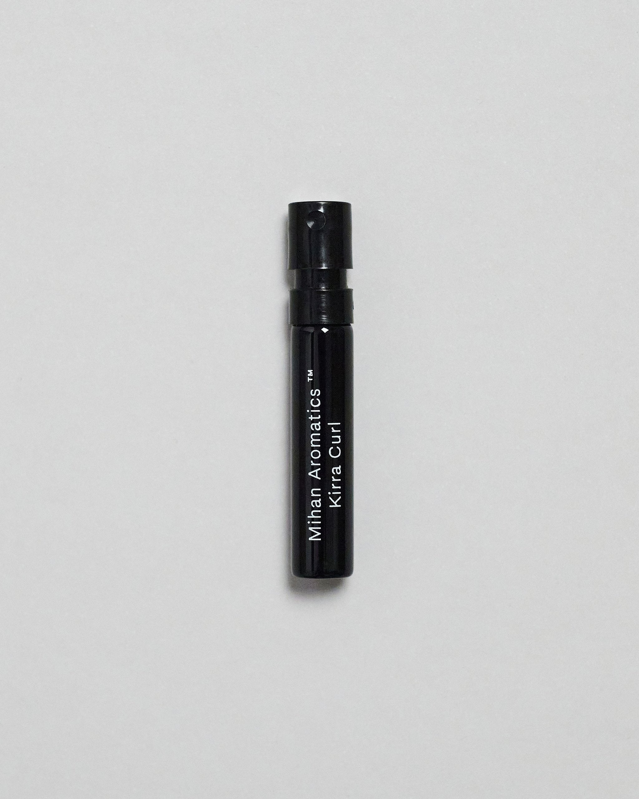 Mihan Aromatics Kirra Curl parfum 2ml sample vial on a pale grey backdrop