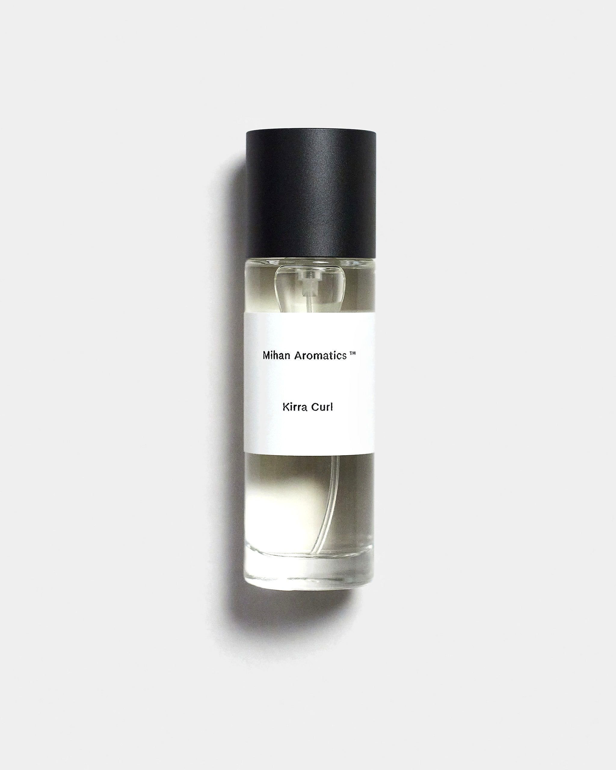 Mihan Aromatics Kirra Curl parfum 30ml bottle with black cap on a Studio Grey backdrop