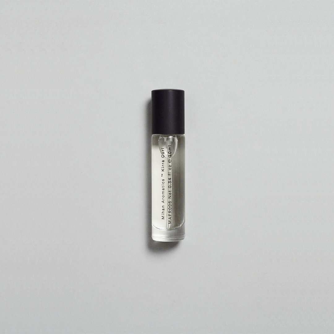 Kirra Curl Parfum by Mihan Aromatics in a sleek roll-on bottle, evoking sun-kissed beach vibes and nostalgia.