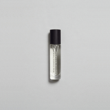Kirra Curl Parfum by Mihan Aromatics in a sleek roll-on bottle, evoking sun-kissed beach vibes and nostalgia.