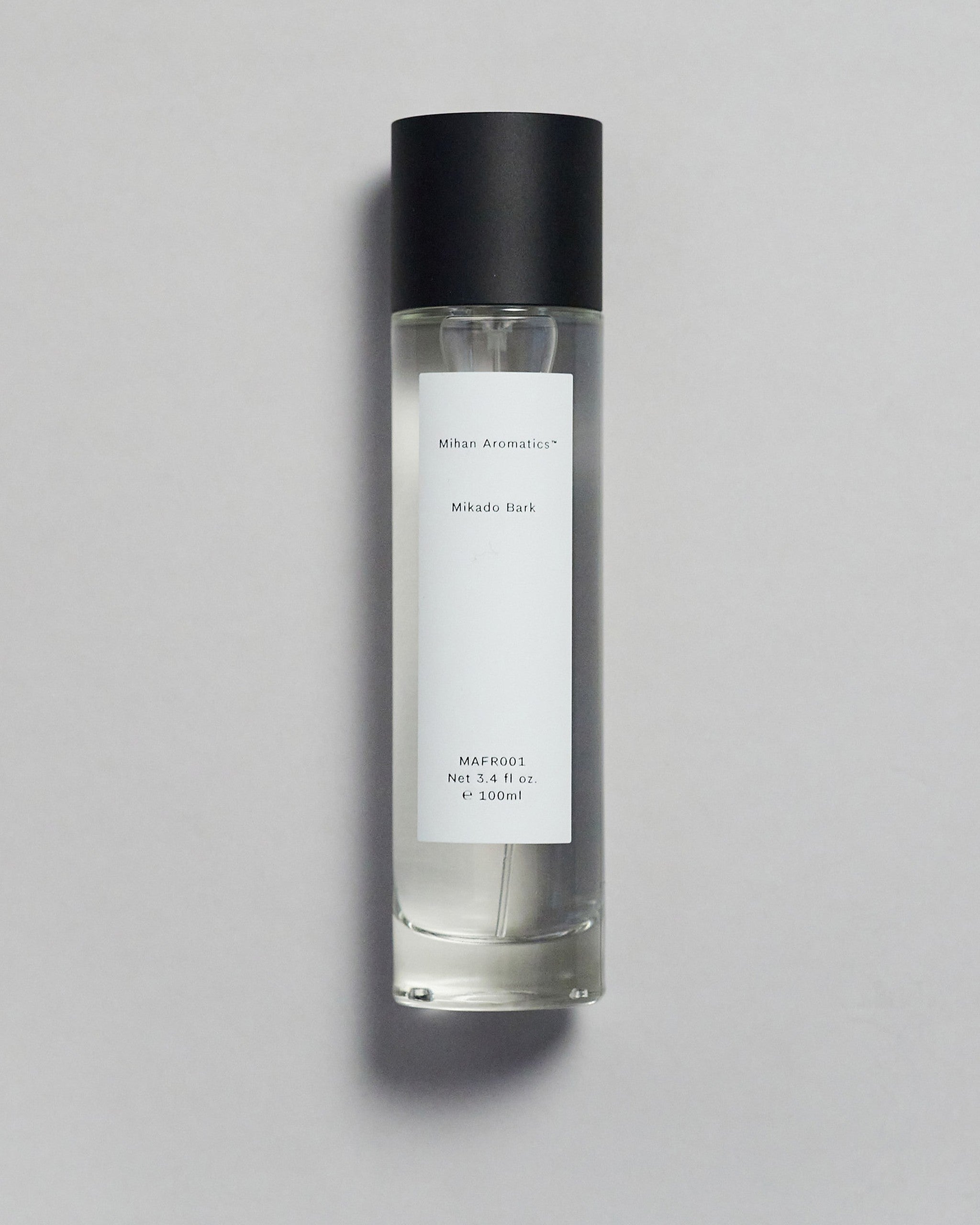 Mihan Aromatics Mikado Bark parfum 100ml bottle with black cap on a pale grey backdrop