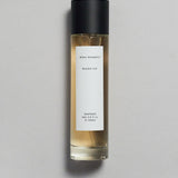 Mihan Aromatics Munlark Ash parfum 100ml bottle with black cap on a pale grey backdrop