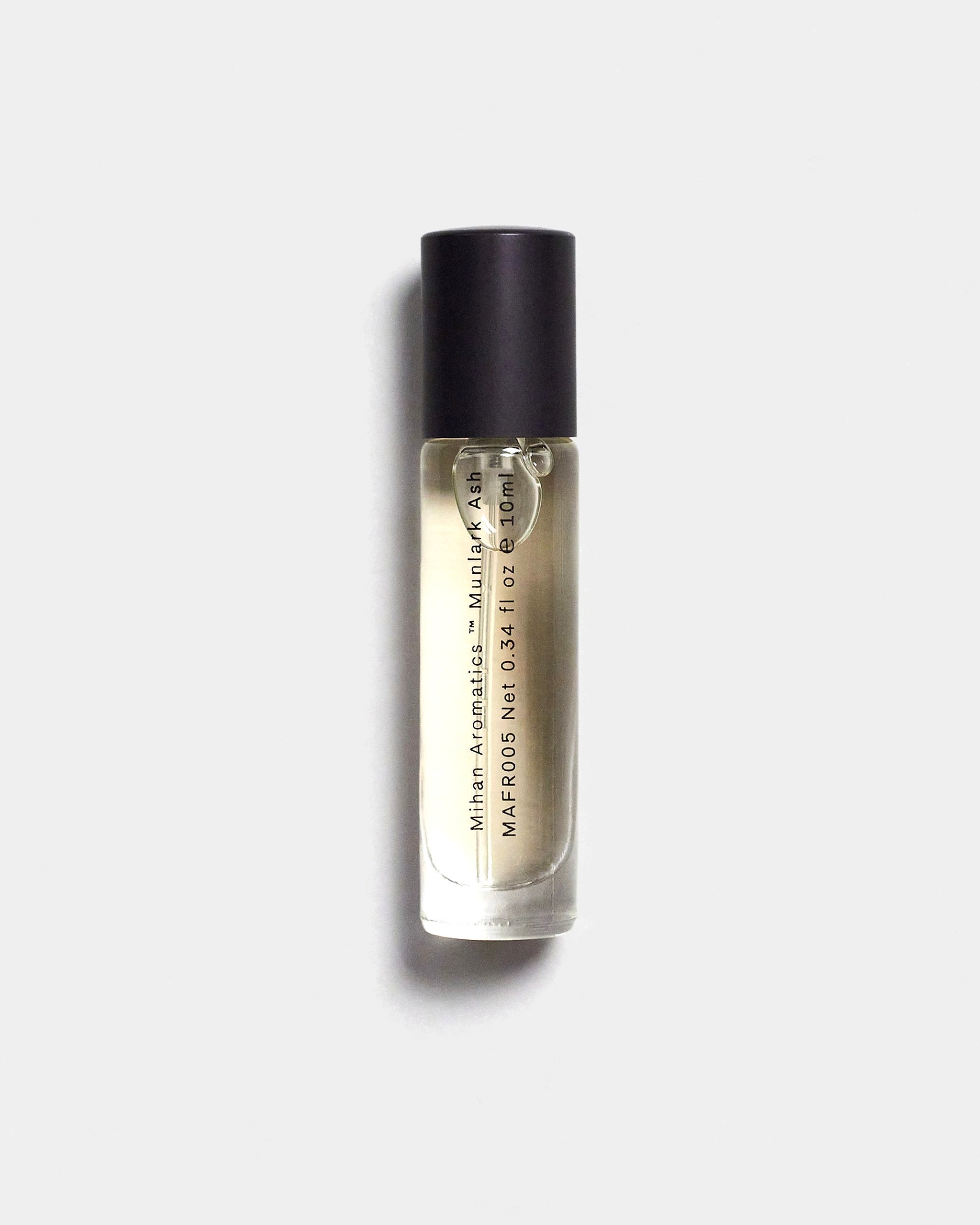 Mihan Aromatics Munlark Ash parfum 10ml bottle with black cap on a Studio Grey backdrop