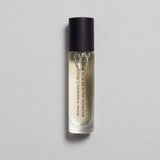 Mihan Aromatics Munlark Ash parfum 10ml bottle with black cap on a pale grey backdrop