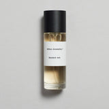 Mihan Aromatics Munlark Ash parfum 30ml bottle with black cap on a pale grey backdrop