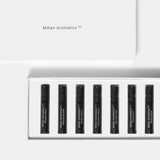 Mihan Aromatics Discovery Set lid above its tray of seven 2ml parfum vials on a Studio Grey backdrop