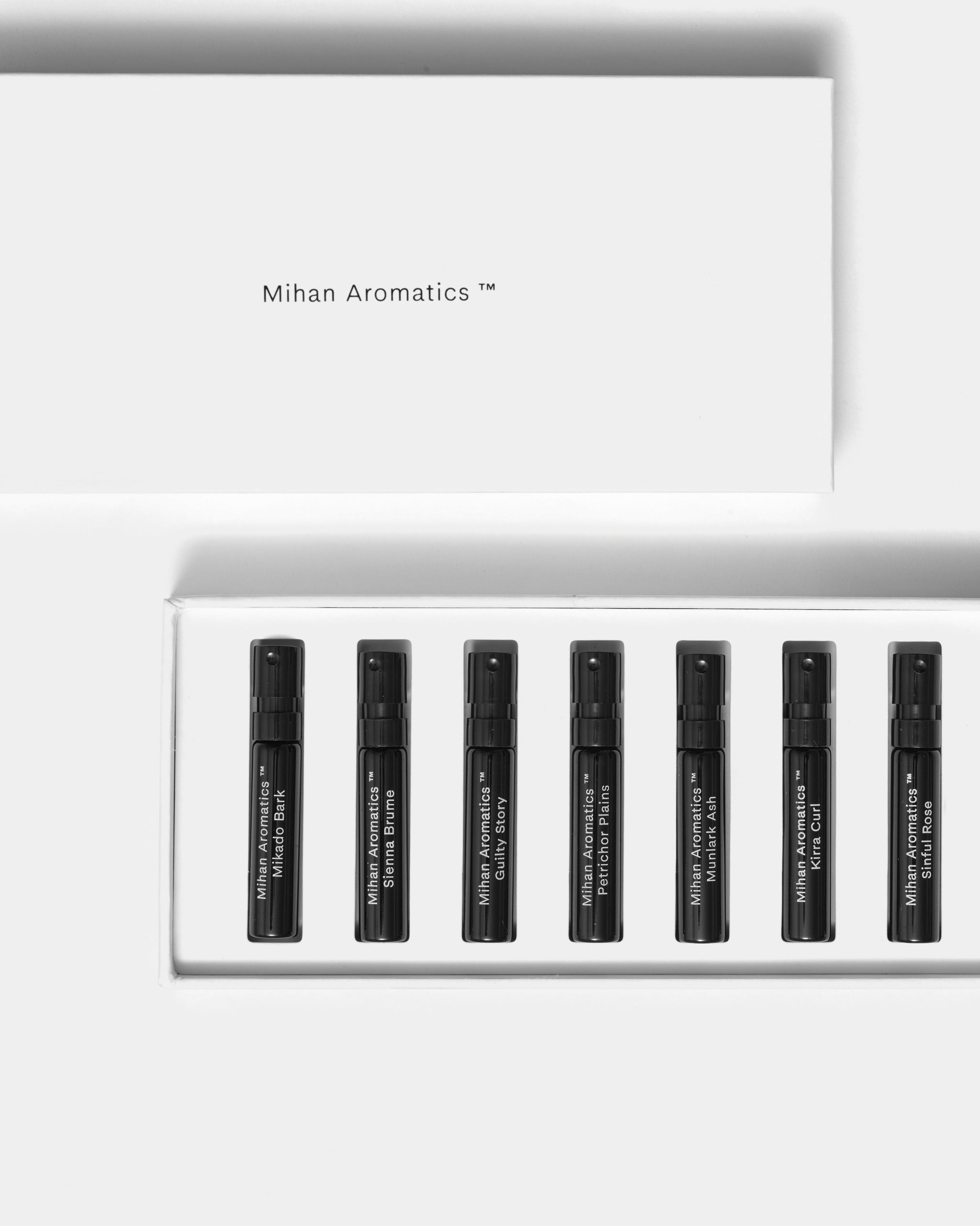 Mihan Aromatics Discovery Set lid above its tray of seven 2ml parfum vials on a Studio Grey backdrop