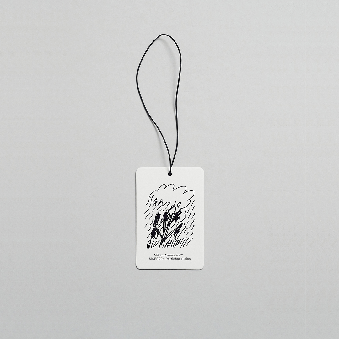 Mihan Aromatics Petrichor Plains Air Fragrance Card with artistic design for car and wardrobe scent enhancement.