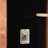 Mihan Aromatics Petrichor Plains Air Fragrance hanging inside a dark timber wardrobe