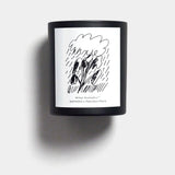 Mihan Aromatics Petrichor Plains candle in a black vessel with illustrated label on a Studio Grey backdrop