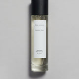 Mihan Aromatics Petrichor Plains parfum 100ml bottle with black cap on a pale grey backdrop