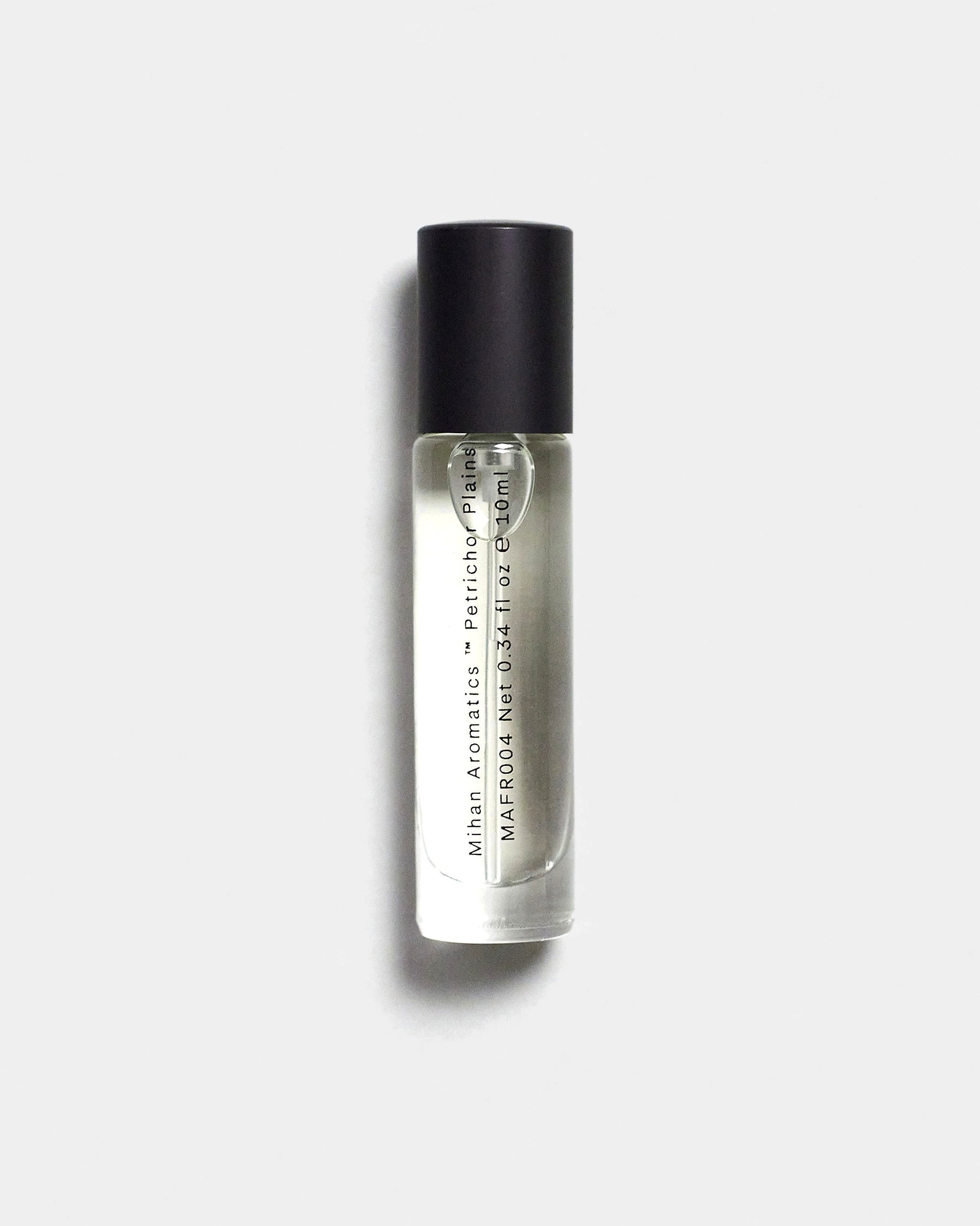 Mihan Aromatics Petrichor Plains parfum 10ml bottle with black cap on a Studio Grey backdrop