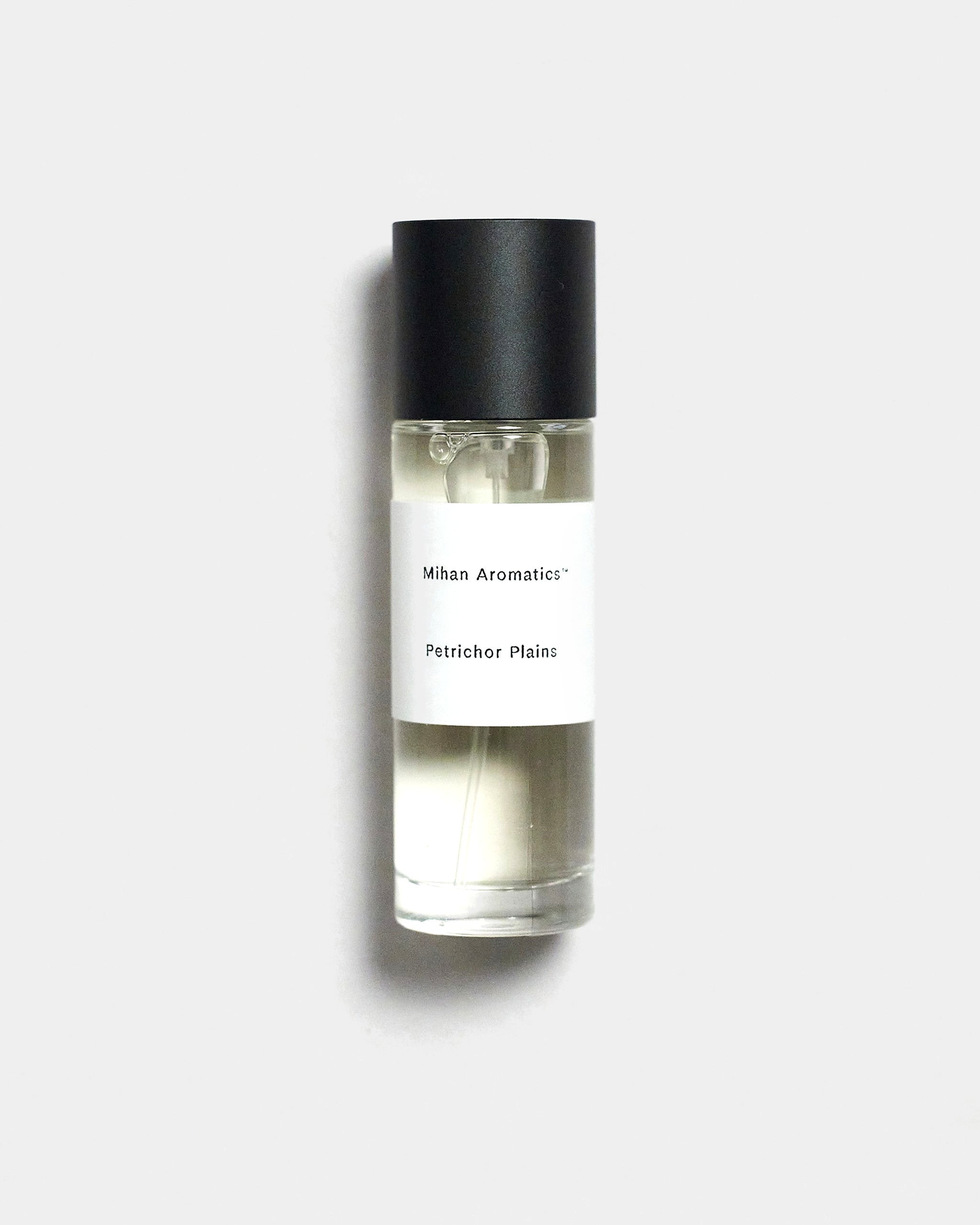 Mihan Aromatics Petrichor Plains parfum 30ml bottle with black cap on a Studio Grey backdrop
