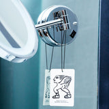 Two Mihan Aromatics Sienna Brume Air Fragrance cards hanging from a bathroom mirror arm