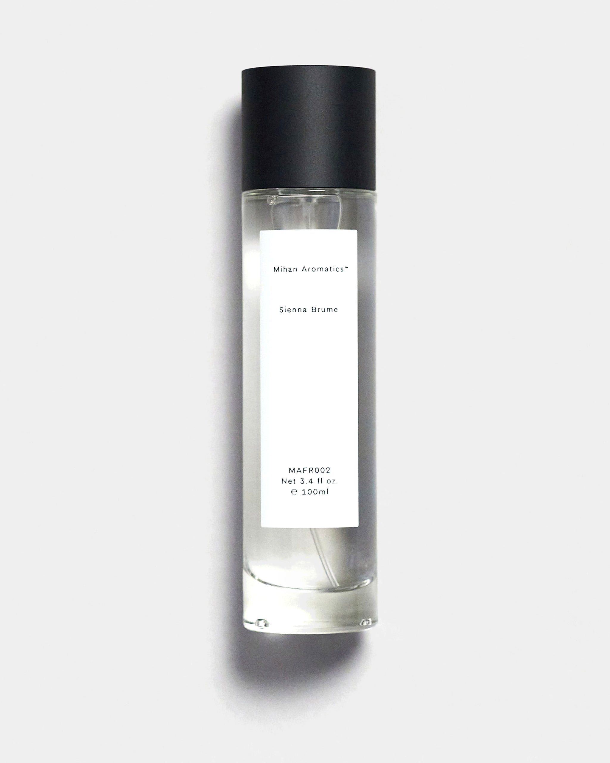 Mihan Aromatics Sienna Brume parfum 100ml bottle with black cap on a Studio Grey backdrop