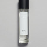 Mihan Aromatics Sienna Brume parfum 100ml bottle with black cap on a pale grey backdrop