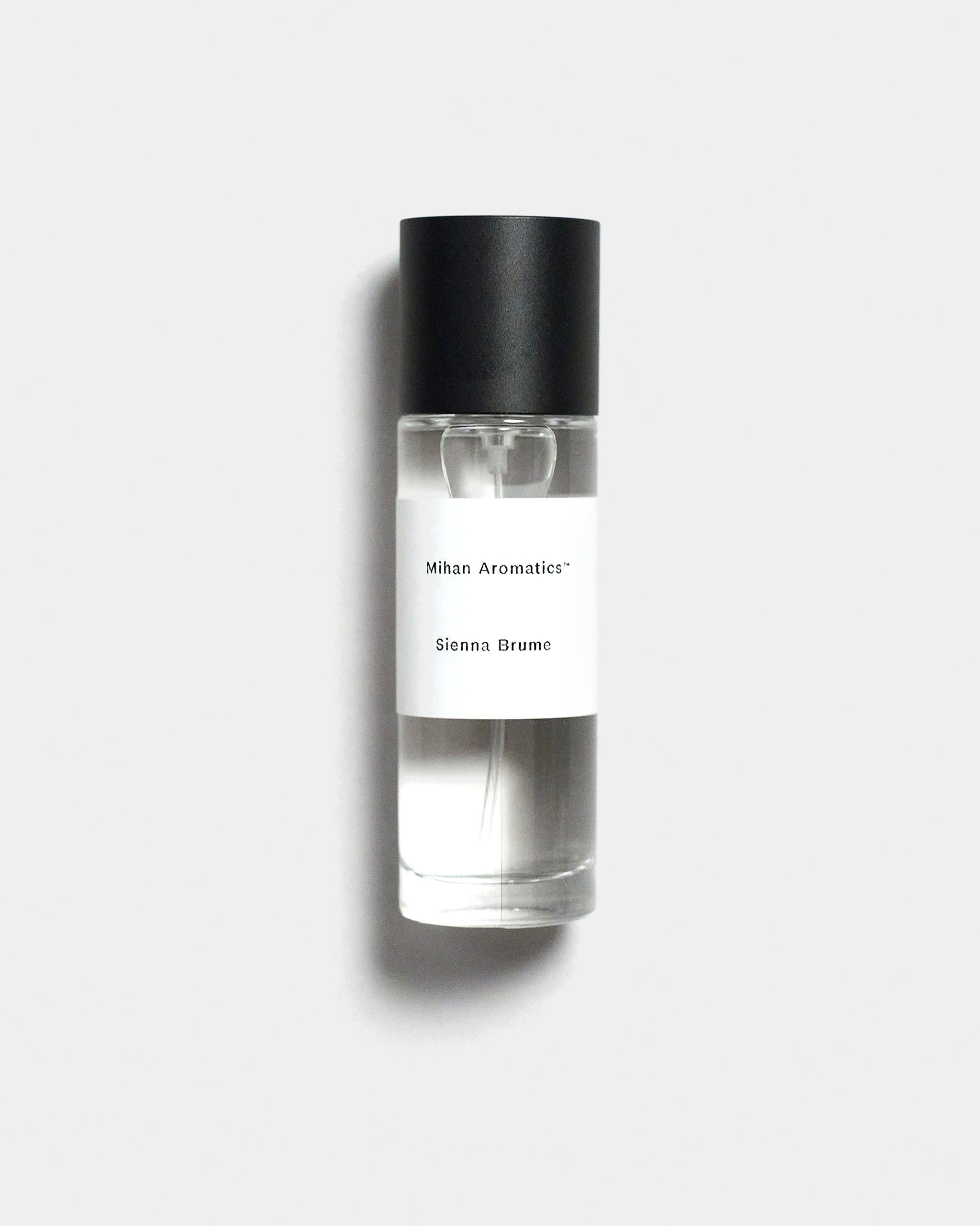 Mihan Aromatics Sienna Brume parfum 30ml bottle with black cap on a Studio Grey backdrop