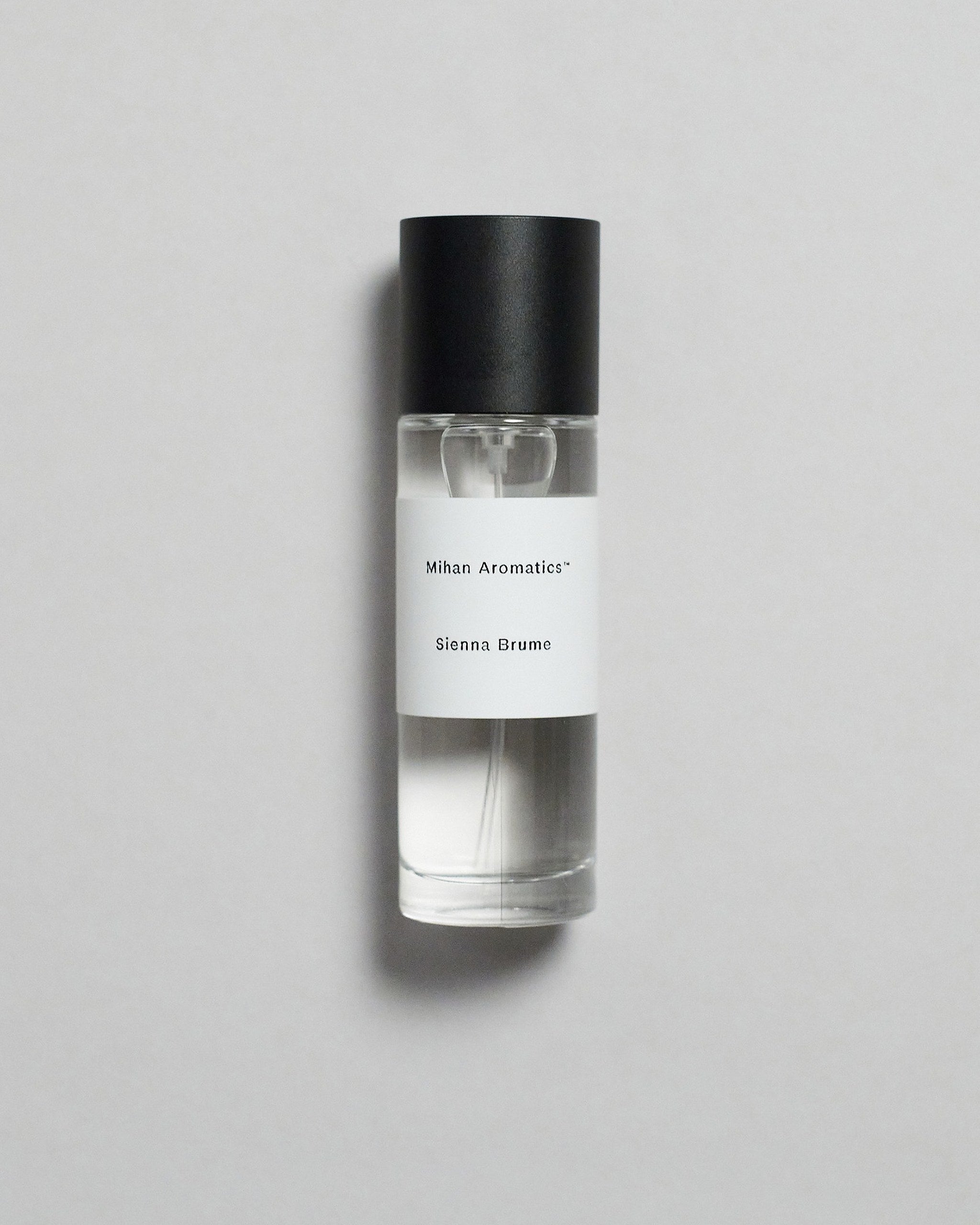 Mihan Aromatics Sienna Brume parfum 30ml bottle with black cap on a pale grey backdrop