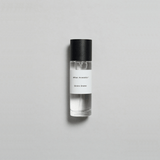 Sienna Brume Parfum bottle on a light background, evoking summer vibes with coconut and cucumber notes.