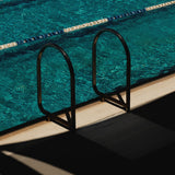 Pool ladder and lane ropes over turquoise water, the summer pool memory behind Mihan Aromatics Sienna Brume parfum