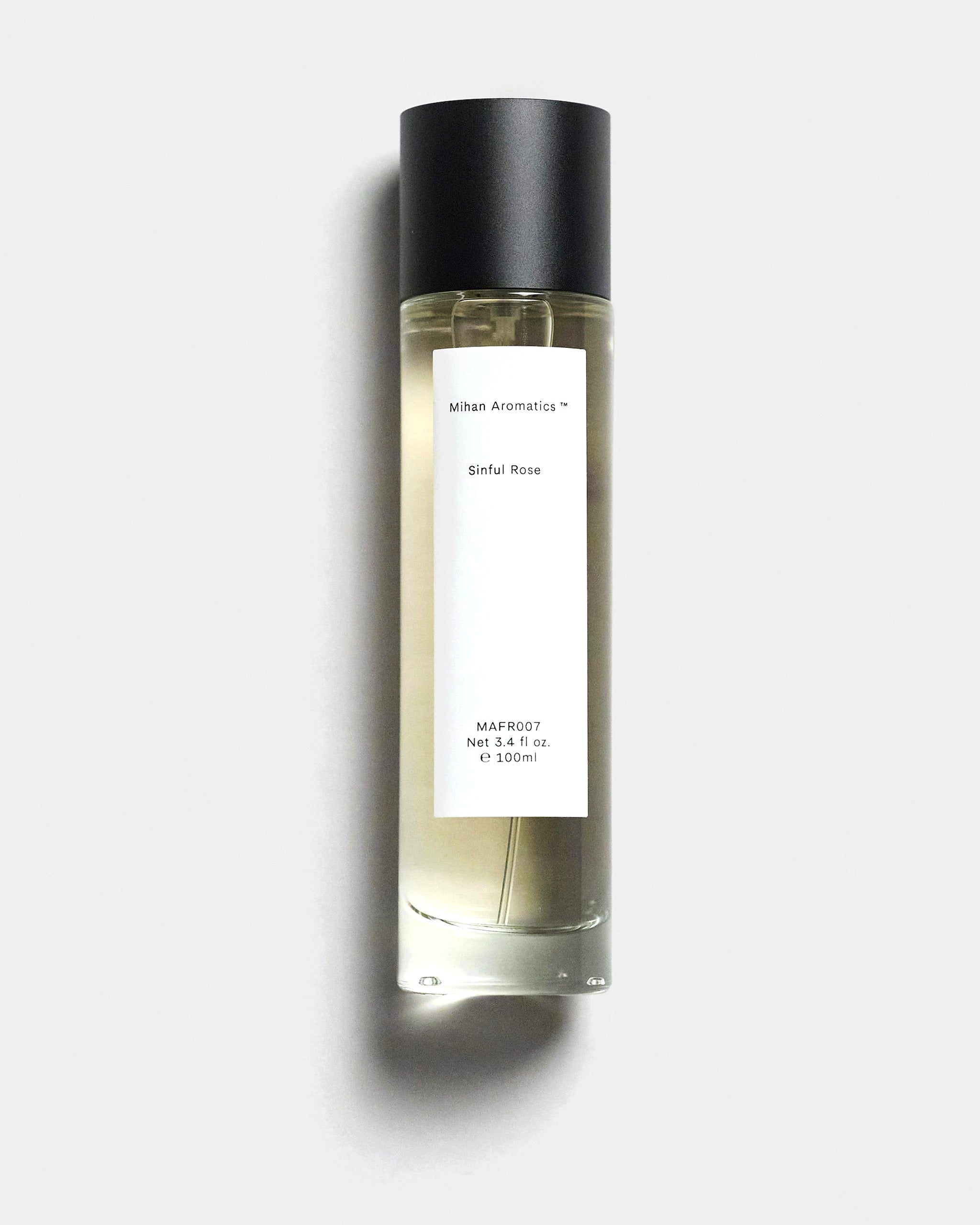 Mihan Aromatics Sinful Rose parfum 100ml bottle with black cap on a Studio Grey backdrop