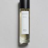 Mihan Aromatics Sinful Rose parfum 100ml bottle with black cap on a pale grey backdrop