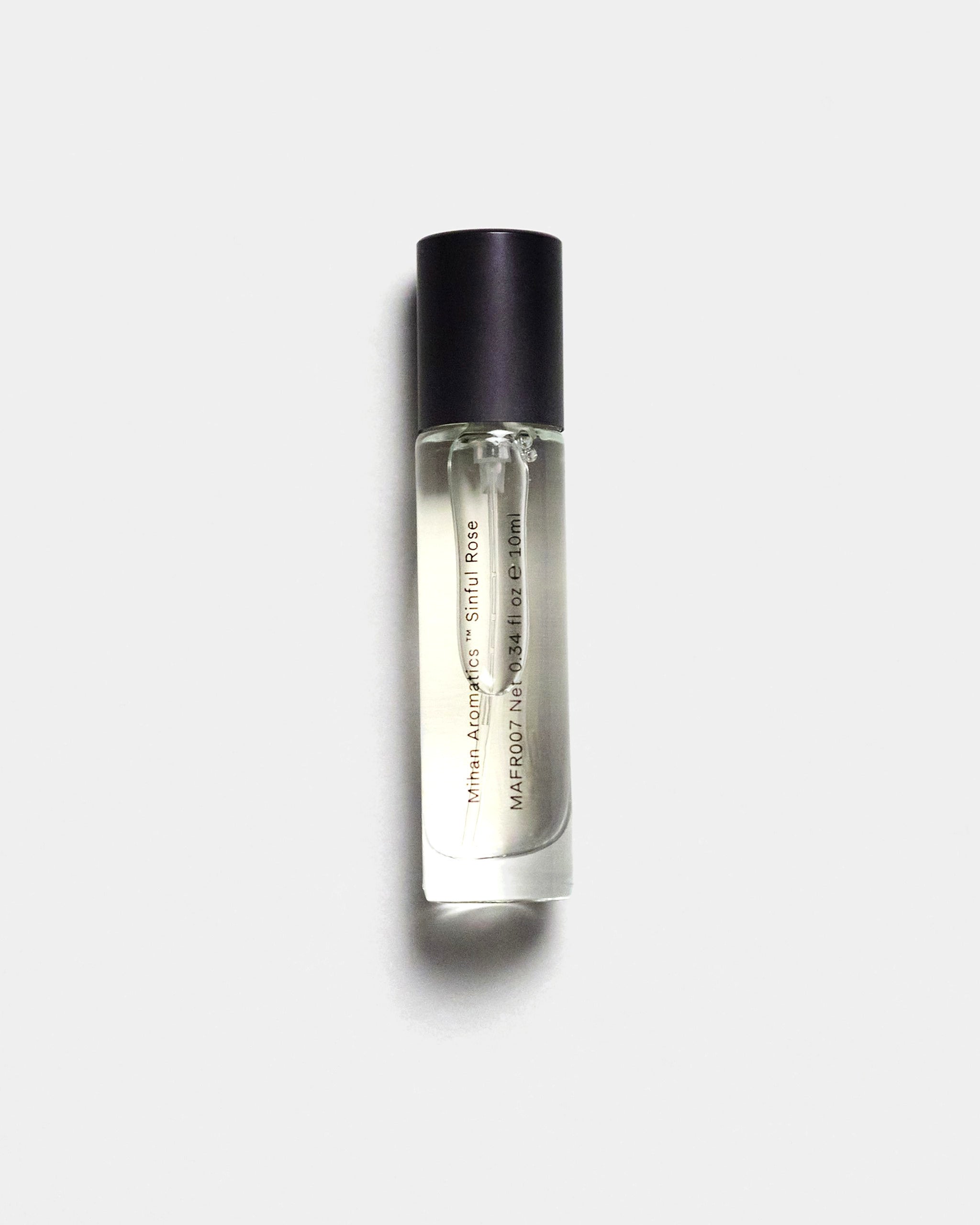 Mihan Aromatics Sinful Rose parfum 10ml bottle with black cap on a Studio Grey backdrop