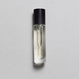 Mihan Aromatics Sinful Rose parfum 10ml bottle with black cap on a pale grey backdrop