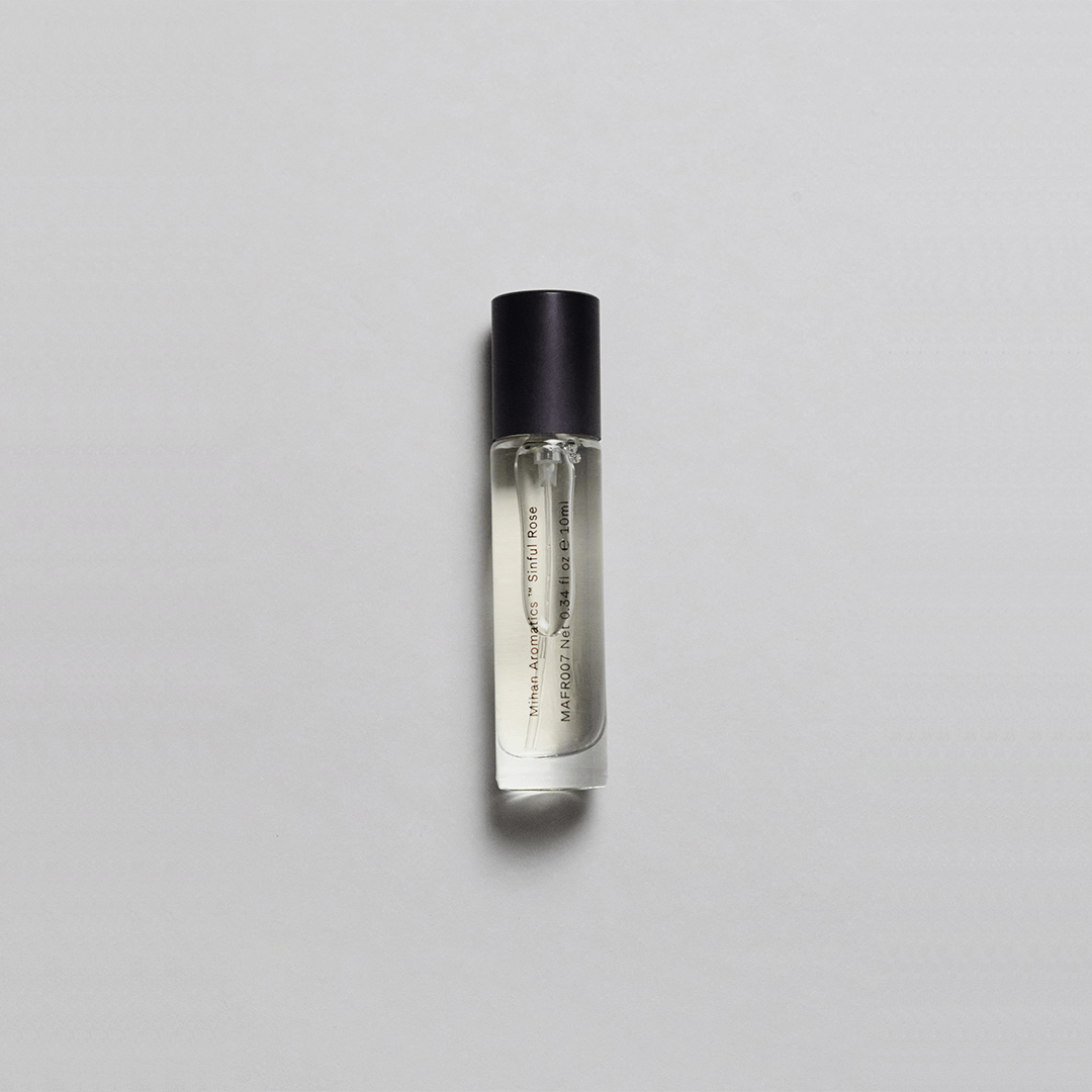 Sinful Rose Parfum by Mihan Aromatics in a sleek bottle, featuring a blend of rose, amber, and oud.